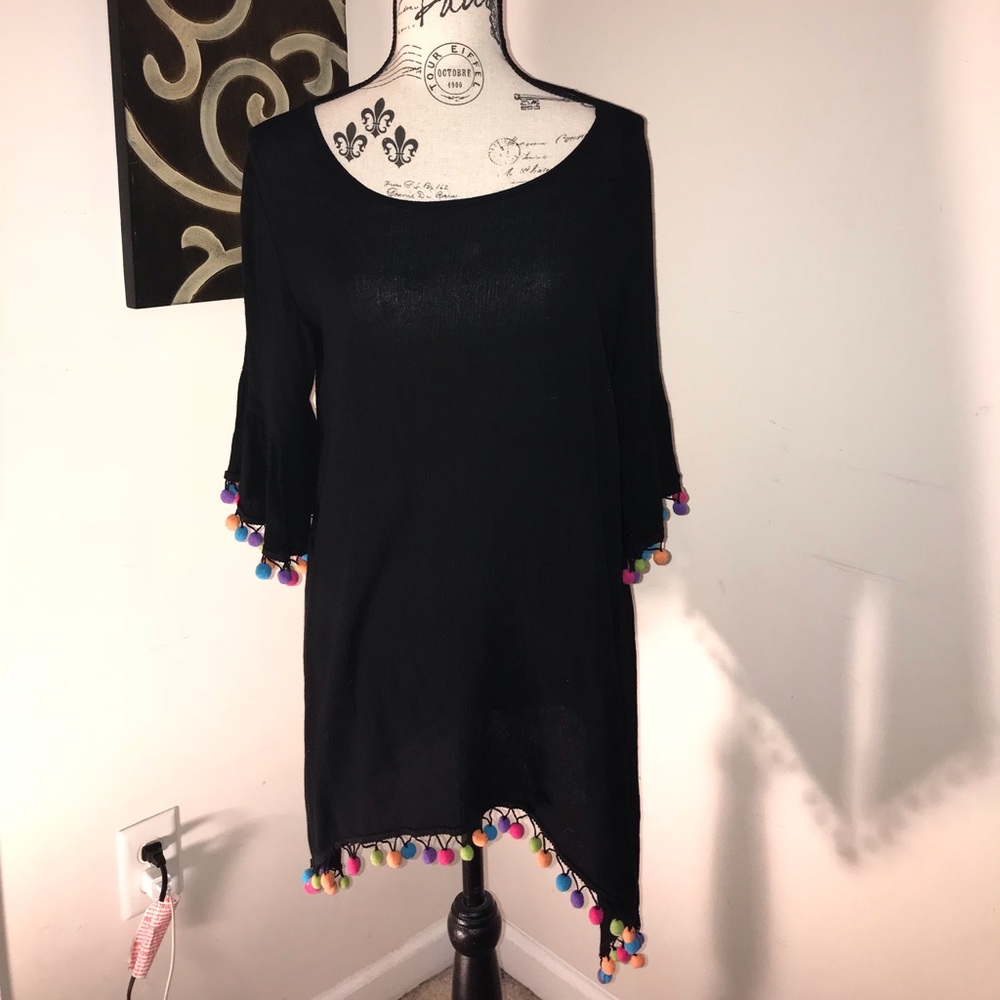Black tunic with colorful pompoms embellishments